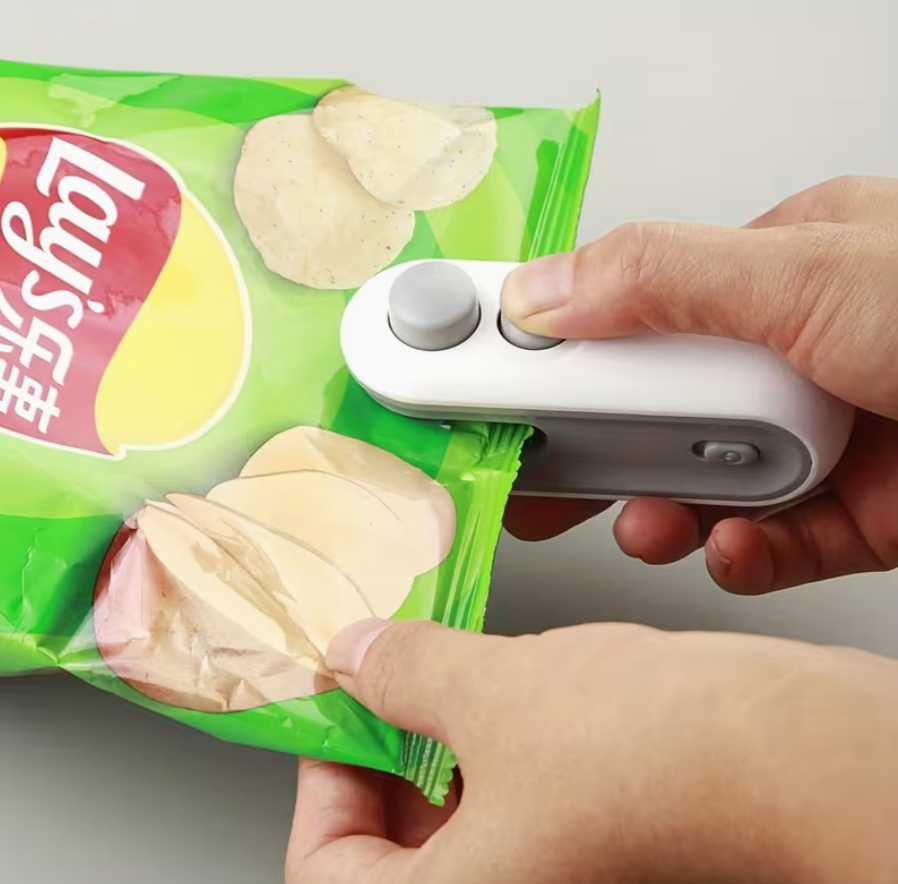 Portable USB rechargeable handheld bag sealer by UK Dropships, compact manual sealing machine for home and garden use.
