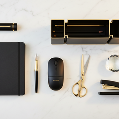 Assorted general office supplies including pens, notebooks, and staplers on a desk