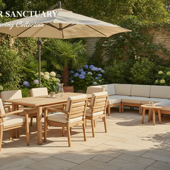 Outdoor furniture set with wooden chairs, table, and cushioned sectional sofa under large umbrella in garden patio