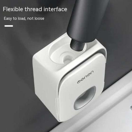 Punch-free wall-mounted toothpaste holder with built-in squeezing tool in white, designed for easy and mess-free toothpaste dispensing.