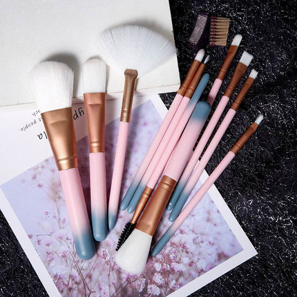 12-piece makeup brush set with colorful handles in box