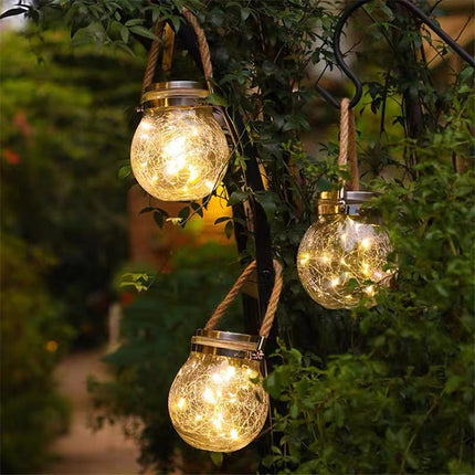 Outdoor Solar LED courtyard light with glass crackle ball illuminating garden patio