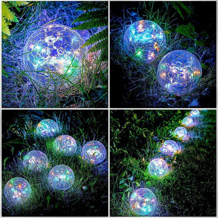 Solar Crackle Ball Light glowing warmly in a garden setting with monocrystalline solar panel and copper wire LED design