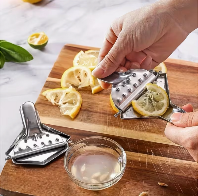 Stainless steel manual citrus juicer with ergonomic handle for easy juice extraction, ideal for home kitchen use.