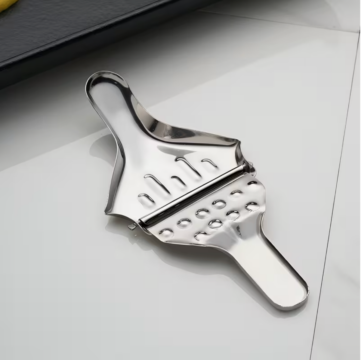 Stainless steel manual citrus juicer with ergonomic handle, ideal for fresh juice extraction in home and garden kitchens.