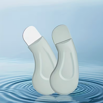 Light green textured facial pore cleanser brush with ergonomic handle for blackhead removal and gentle skin cleansing.