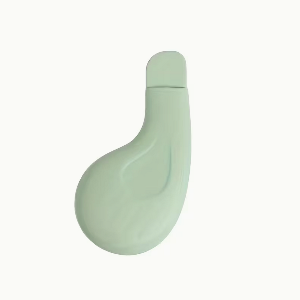 Light green textured facial pore cleanser brush with ergonomic handle, ideal for blackhead removal and gentle skincare.