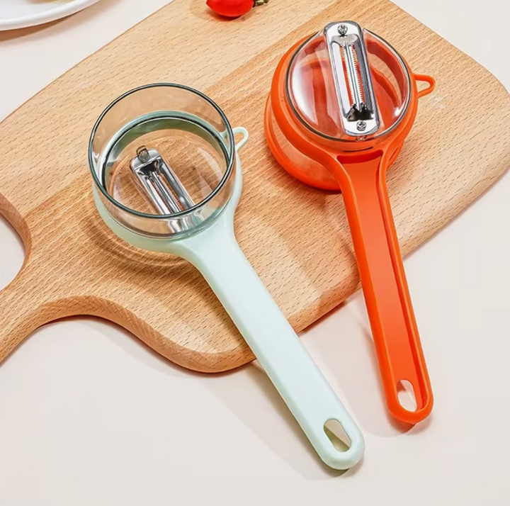Stainless steel storage peeler with container and serrated blade, ideal for kitchen food prep and organization.