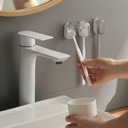 Plastic wall-mounted toothbrush holder by UK Dropships, no-drill dustproof organizer for bathroom and travel storage.