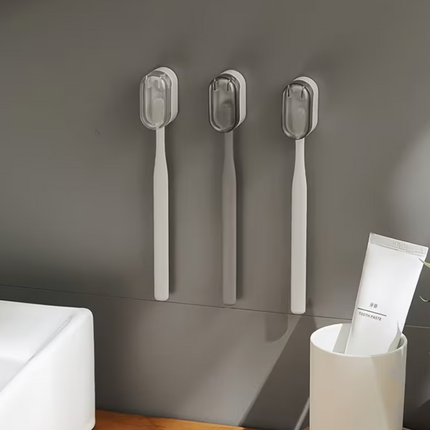 Plastic wall-mounted toothbrush holder by UK Dropships, no-drill dustproof bathroom organizer with easy carry storage box.