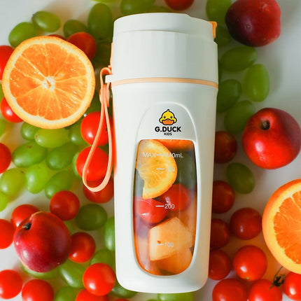 Portable electric juicer cup in green and orange, compact and lightweight for home and travel use