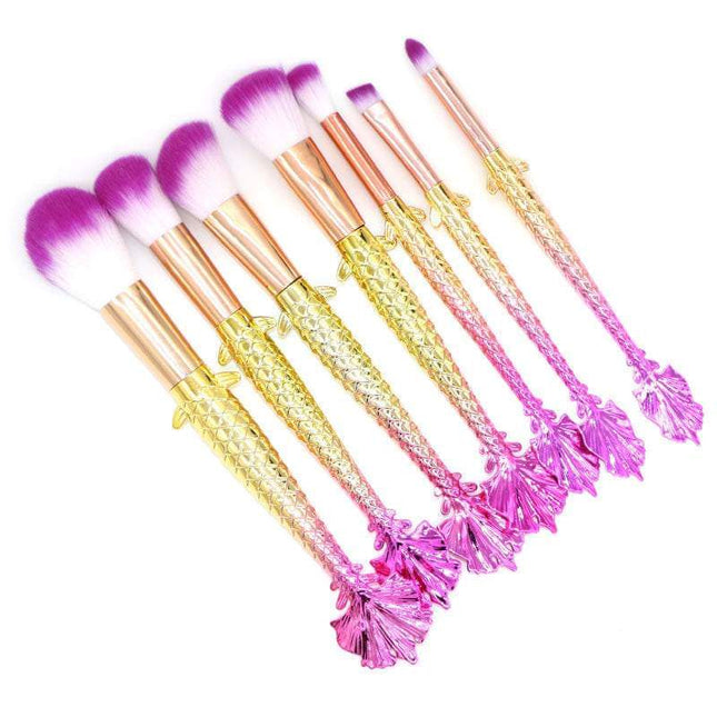 7-piece makeup brush set in yellow-green gradient with soft rayon bristles and ergonomic plastic handles