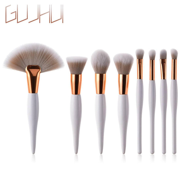 8-piece makeup brush set with black handles and silver ferrules on white background