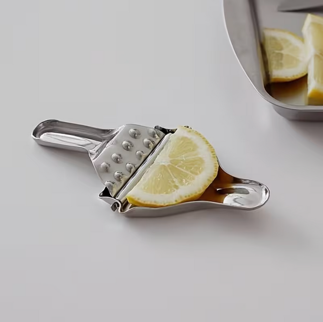 Stainless steel manual citrus juicer with ergonomic handle for easy juice extraction, ideal for home and garden use.