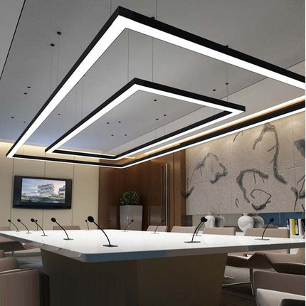 Seamless square LED pendant light hanging in commercial space with modern design