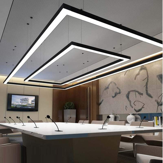 Seamless square LED pendant light hanging in commercial space with modern design