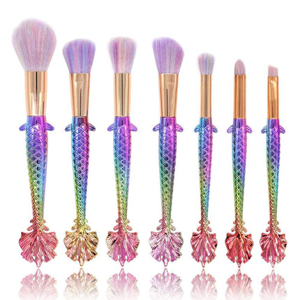 7-piece makeup brush set with yellow-green gradient handles and soft rayon bristles for precise makeup application