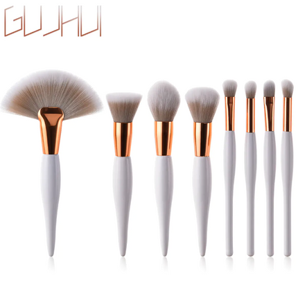 8-piece makeup brush set with black handles and silver tubes for precise application