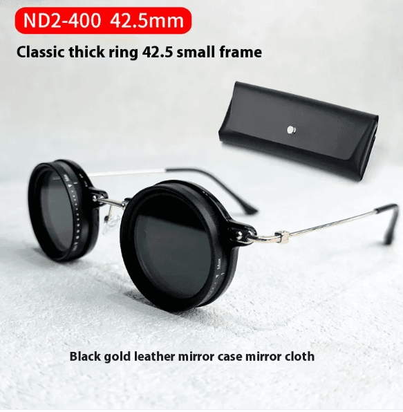 Compact light-reducing glasses case with hard polycarbonate shell and soft foam interior for protective eyewear storage