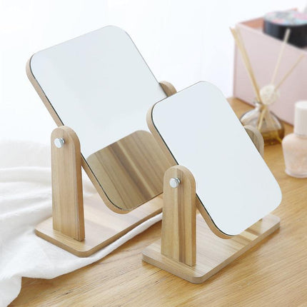Large heart-shaped desktop mirror with clear glass reflection for makeup and grooming on a stable plastic base
