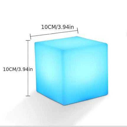 Rechargeable cube LED stool table with remote control showing colorful ambient lighting in a modern living room setting