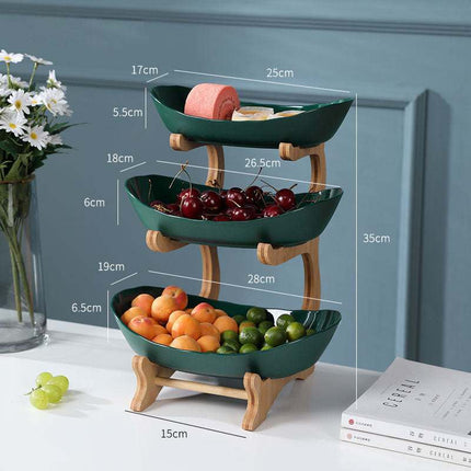 Multi-layer fruit rack with modern geometric design in beige, peacock green, and white, ideal for versatile home storage and display