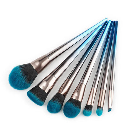 7-piece diamond makeup brush set in blue-black gradient with diamond-shaped handles and artificial fiber bristles
