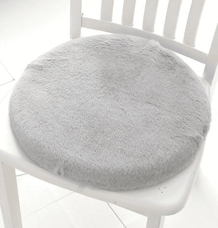 Plush faux fur memory foam cushion in blush pink for decorative home comfort