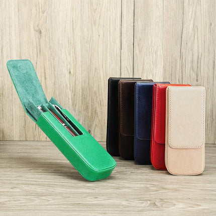 Set of three handmade leather pen cases with magnetic drawers in brown, blue, and red colors