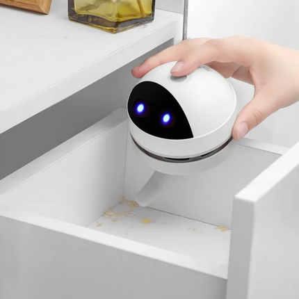 Compact Robot Desktop Vacuum Cleaner with USB charging on office desk