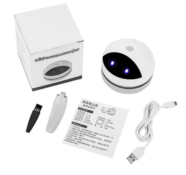 Compact robot desktop vacuum cleaner with USB charging and 120-minute runtime on office desk