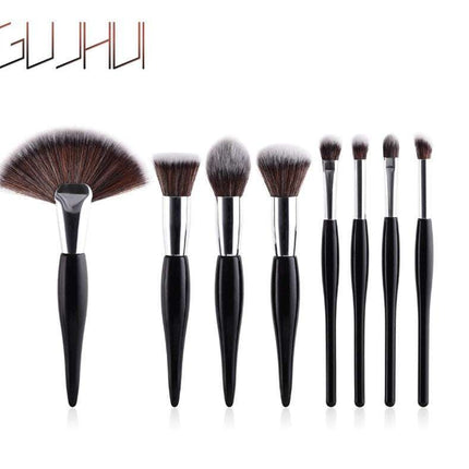 8-piece professional makeup brush set with black handles and silver tubes