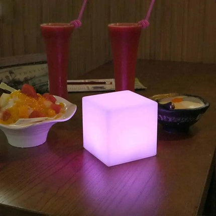Rechargeable Cube LED Stool Table with remote control and multicolor lighting in modern indoor setting