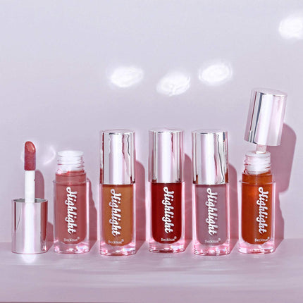 Set of five High Gloss Lip Gloss tubes in nude to berry shades with mirror finish and packaging