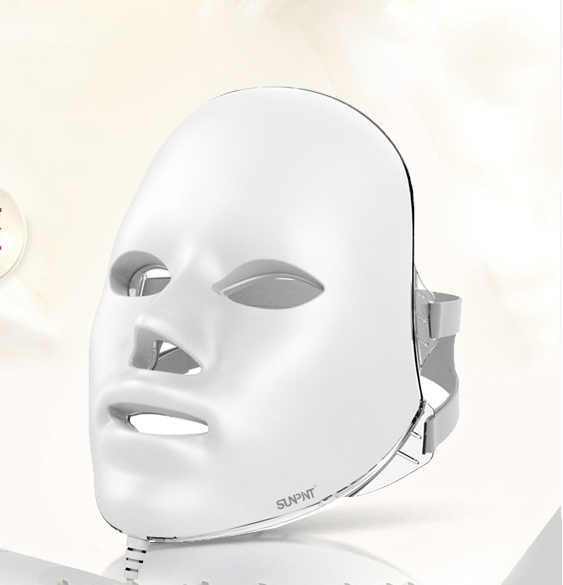 Compact home electronic whitening and rejuvenating beauty device with LED light therapy for skin brightening and anti-aging benefits