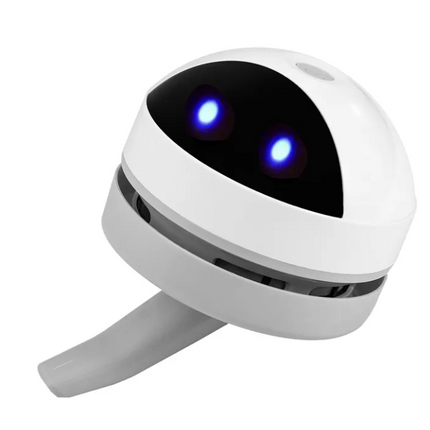 Compact Robot Desktop Vacuum cleaner on office desk with USB charging cable