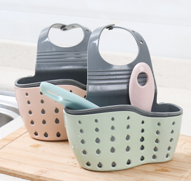Adjustable rubber sink drainer basket in pink for kitchen sponge storage with efficient water drainage and hook installation