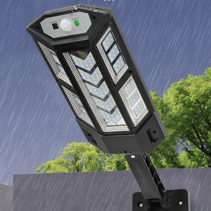 Outdoor solar wall light with remote control and motion sensor mounted on exterior wall