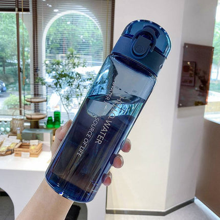Leakproof portable water bottle with straw in white, pink, and blue colors, 780ml capacity