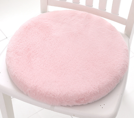 Faux Fur Memory Foam Cushion in blush pink on sofa providing plush comfort and stylish decor