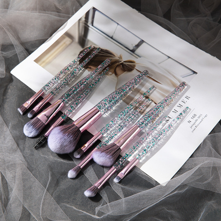 10-piece synthetic fiber makeup brush set with colorful handles and storage bags for precise beauty application and blending